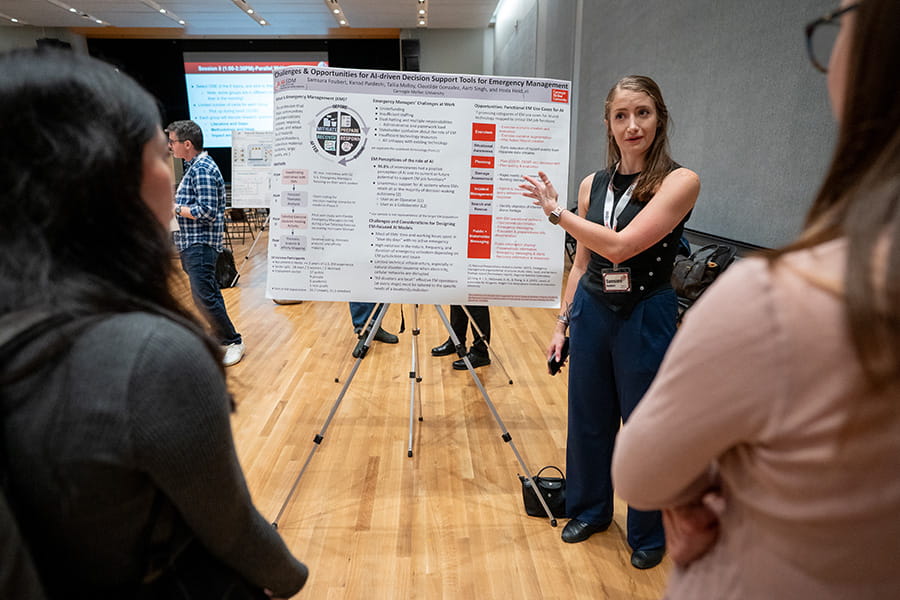 Image of student presenting research at a poster session