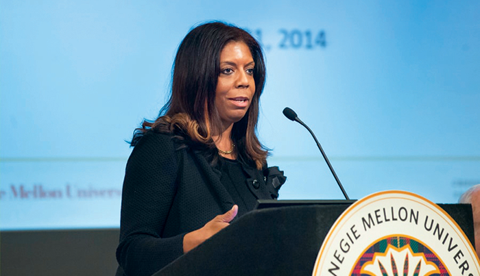 CMU Professor Kiron Skinner Speaking at a podium