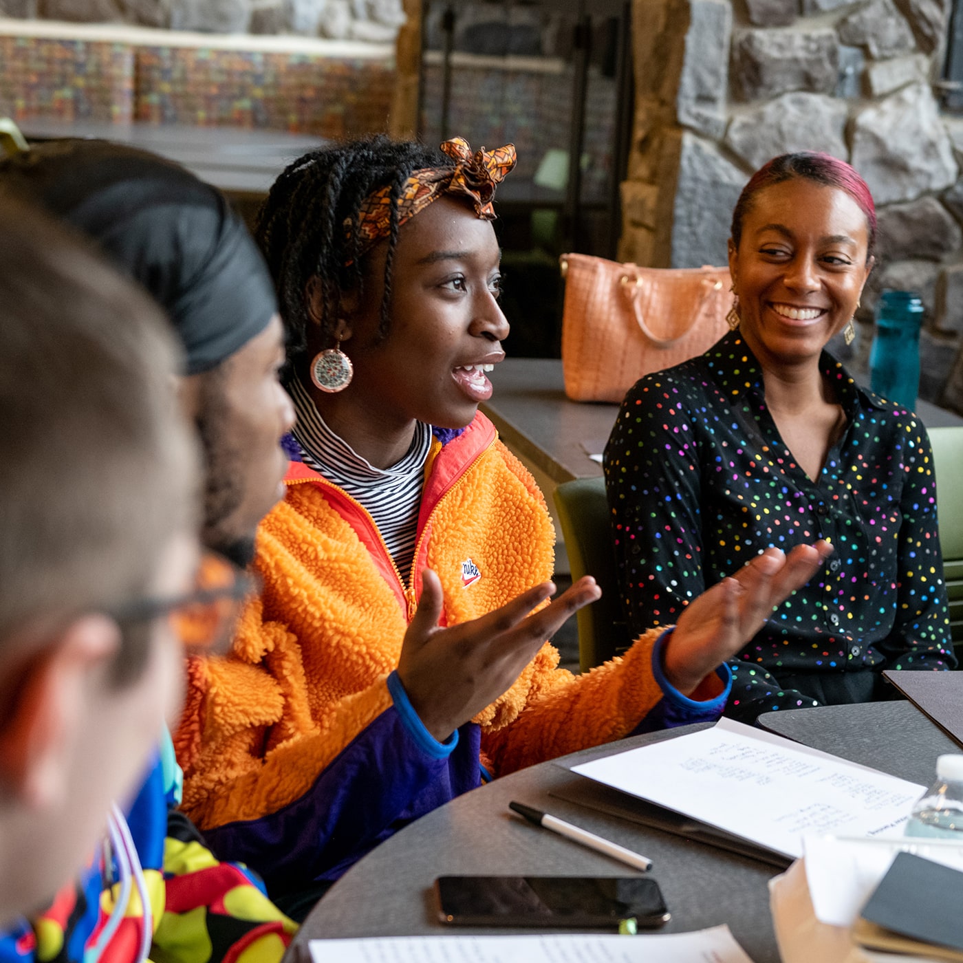 Image of students around a table