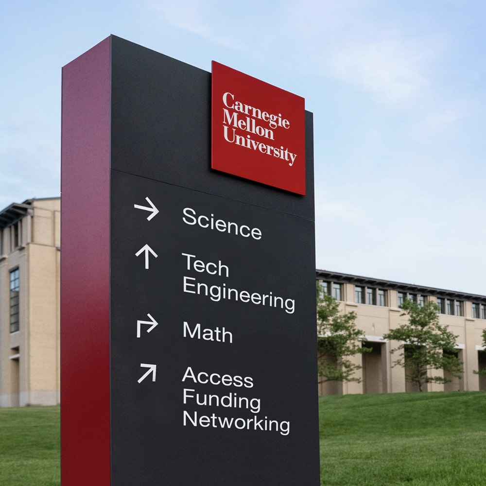 A Carnegie Mellon directional sign with arrows pointing toward science, tech engineering, math and Access Funding Network