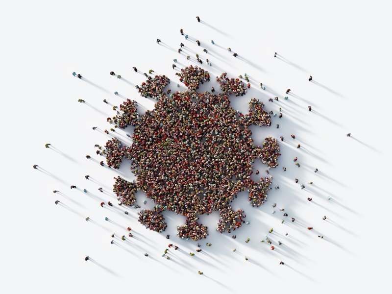 A human crowd forming a virus