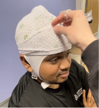 Brainamp MR32 Channel EEG System on woman's head