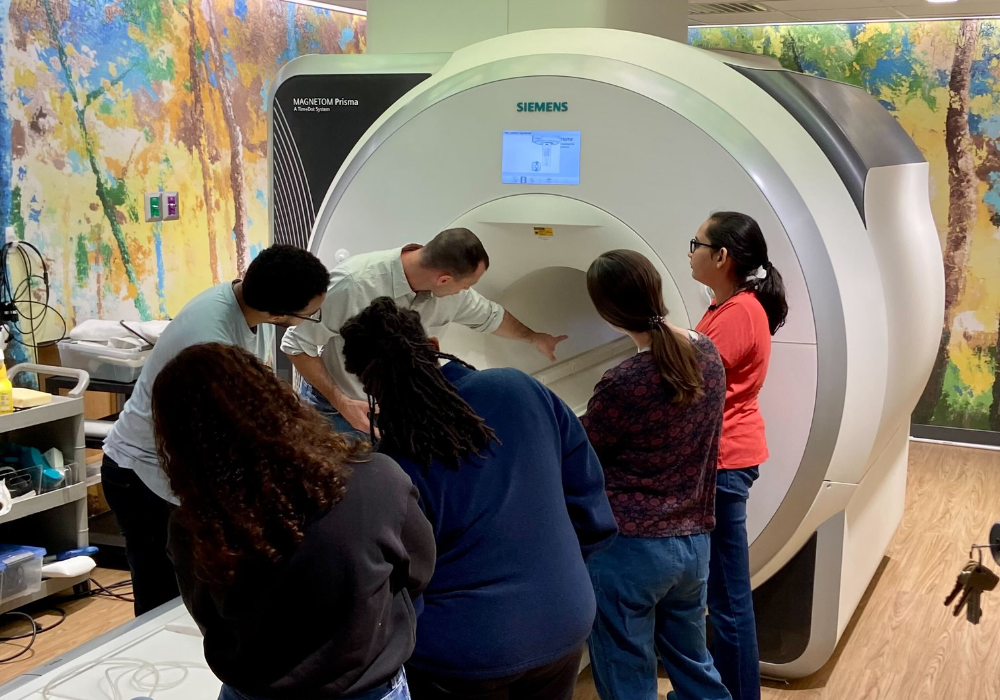 Bridge Center Machine with research students gathered around