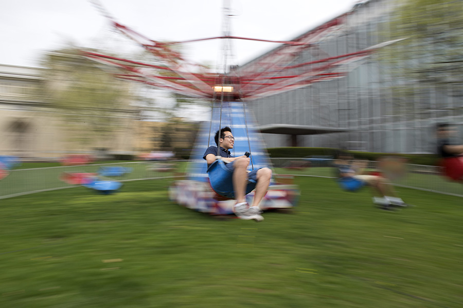 A photo of a student riding a fair ride