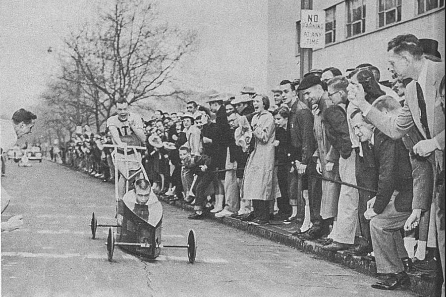 A photo of a man pushing an early iteration of the buggy