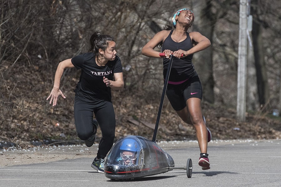 A photo of a pusher racing a buggy