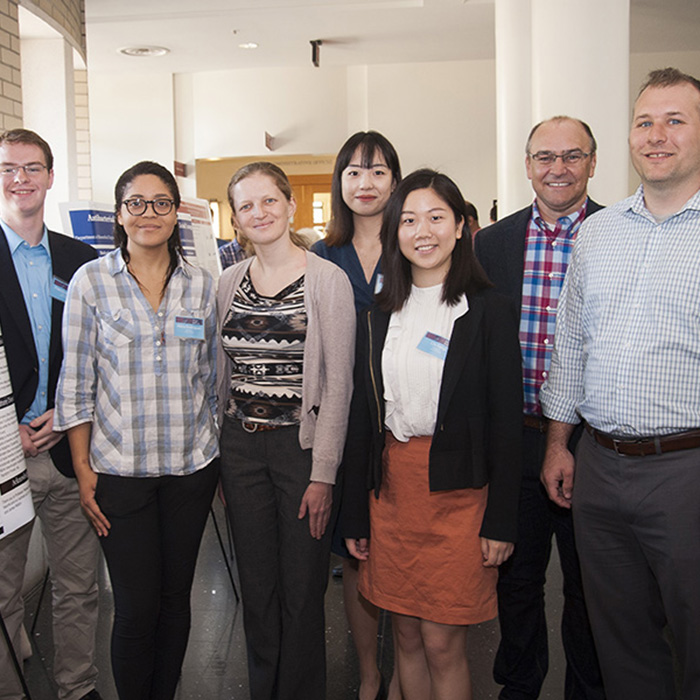 A group from C.H. Robinson — Elena Yudovina, data scientist, who was the point of contact for the student team; Brett Cooksey, director of technology, digitalization strategy; and Ian Allison, a senior sales executive