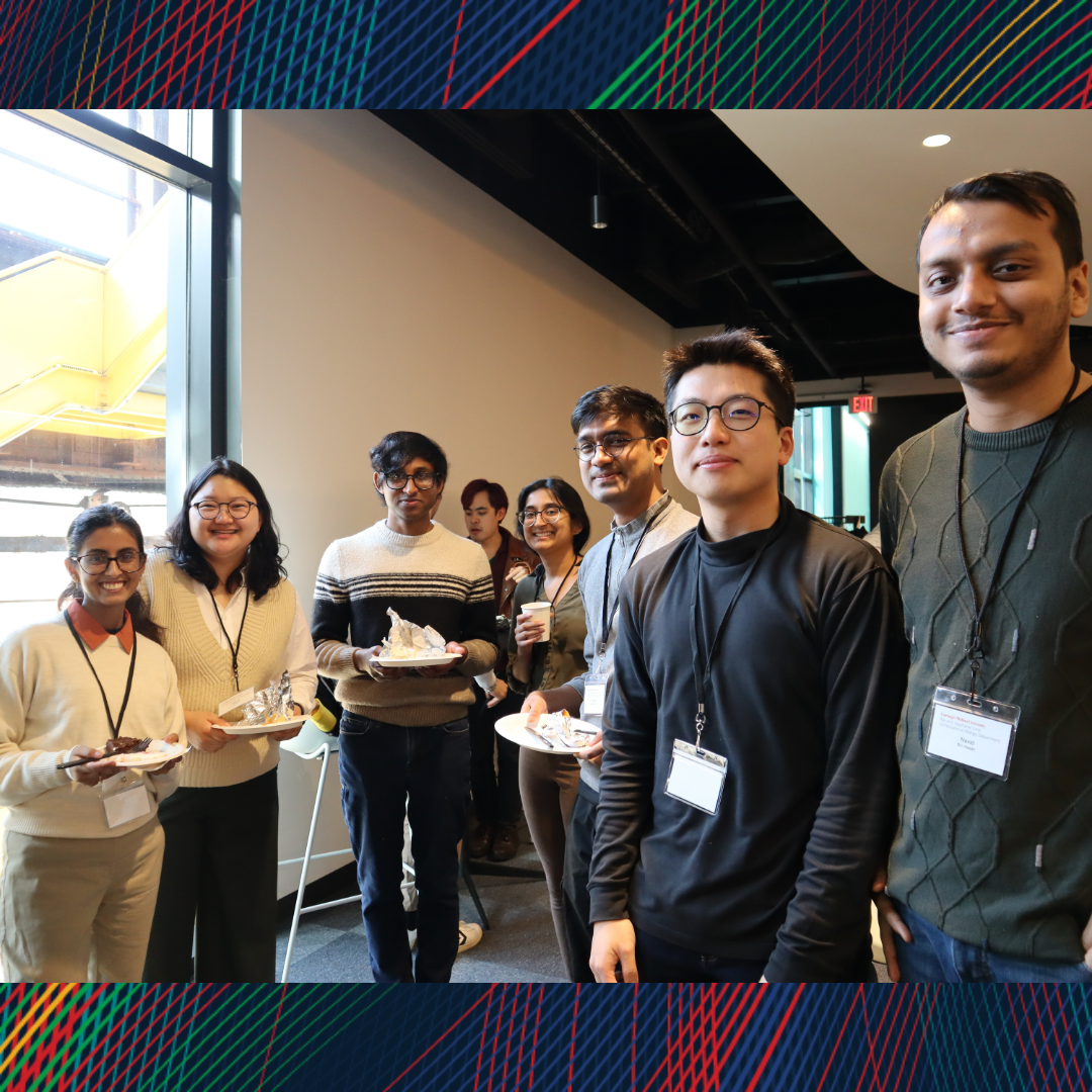 A group of students standing and smiling at the camera