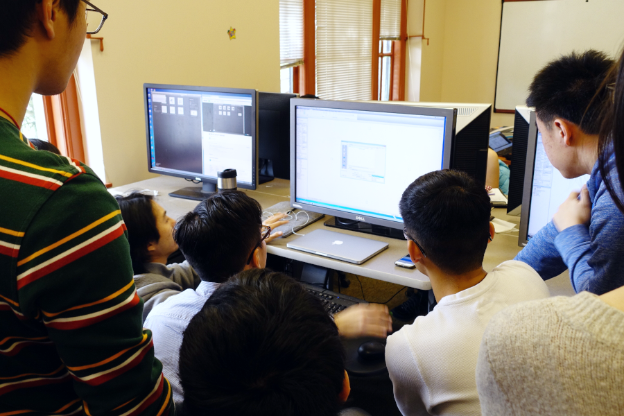 group of students discuss BIM project with professor 