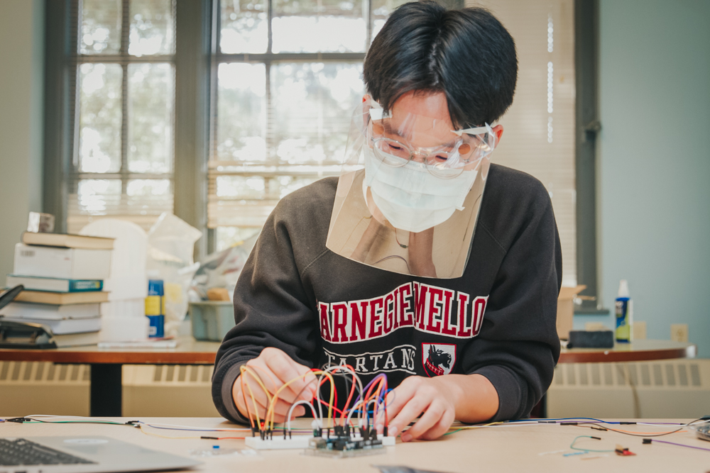 Undergraduate student works with sensors for capstone course