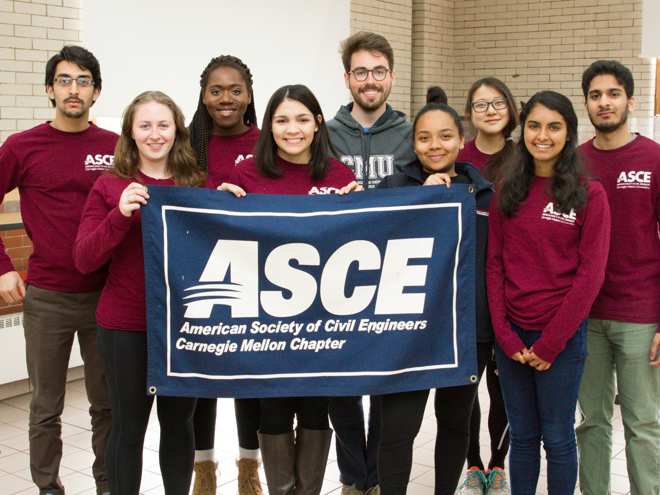 Group of students holding up ASCE banner
