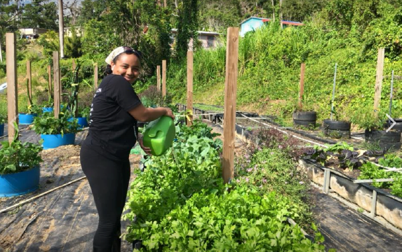Ariana Sabbat tending crops 