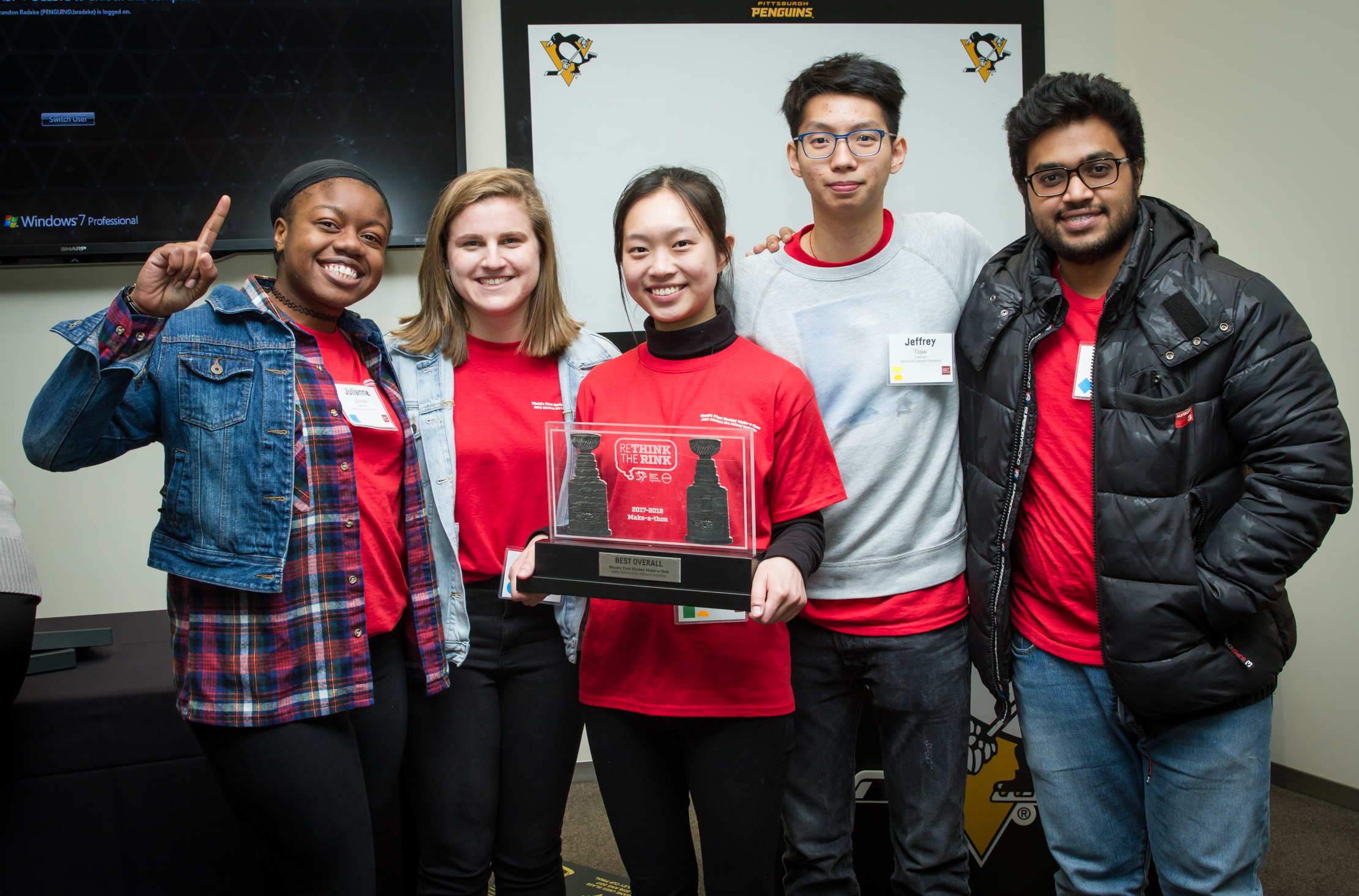 Sally Chen (center) holds her team’s first place award at the 2018 Rethink the Rink competition