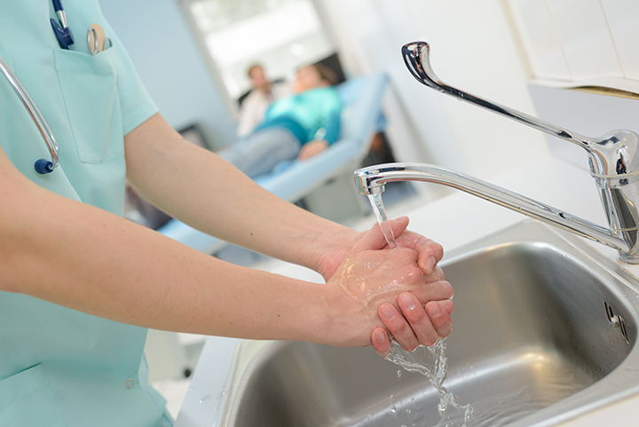 Medical professional washing their hands