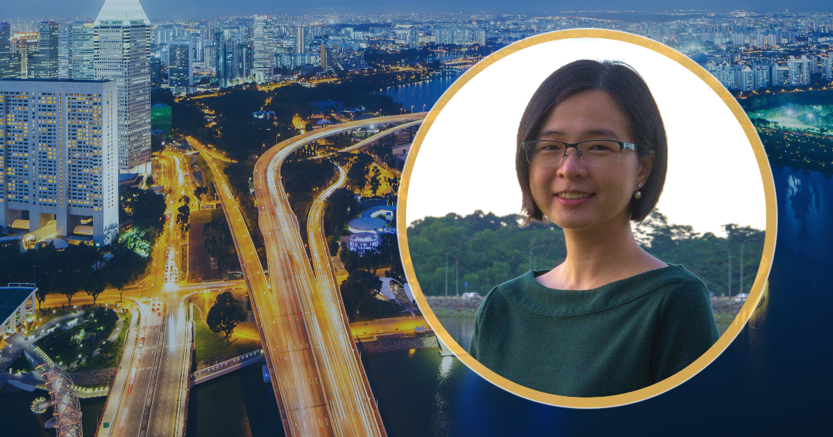 Denise Yam in front of Singapore landscape
