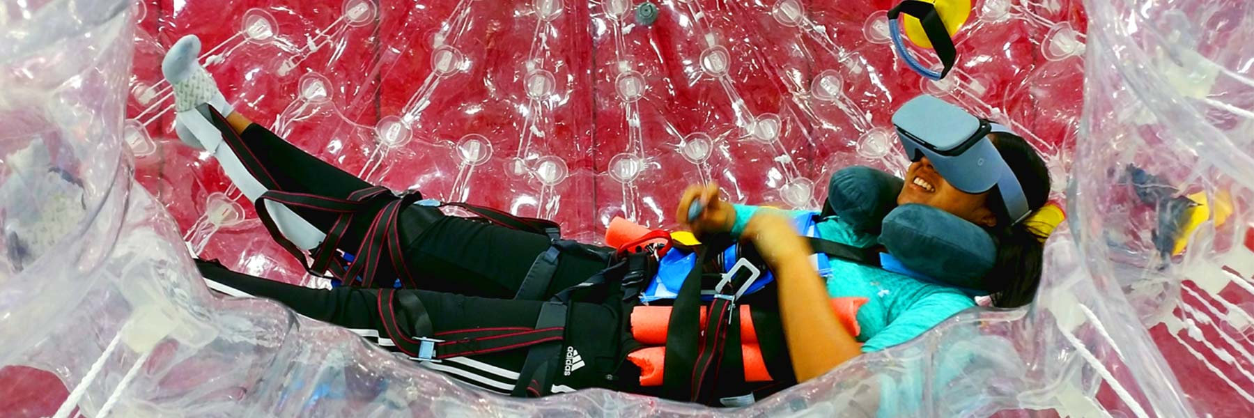 Student in an inflatable sphere.