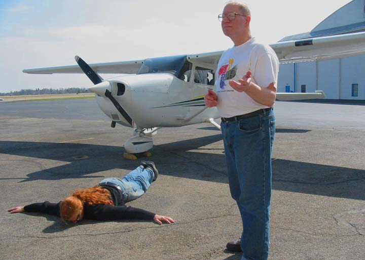 William Kofmehl and Ken Meyer at airport, doing an art performance.