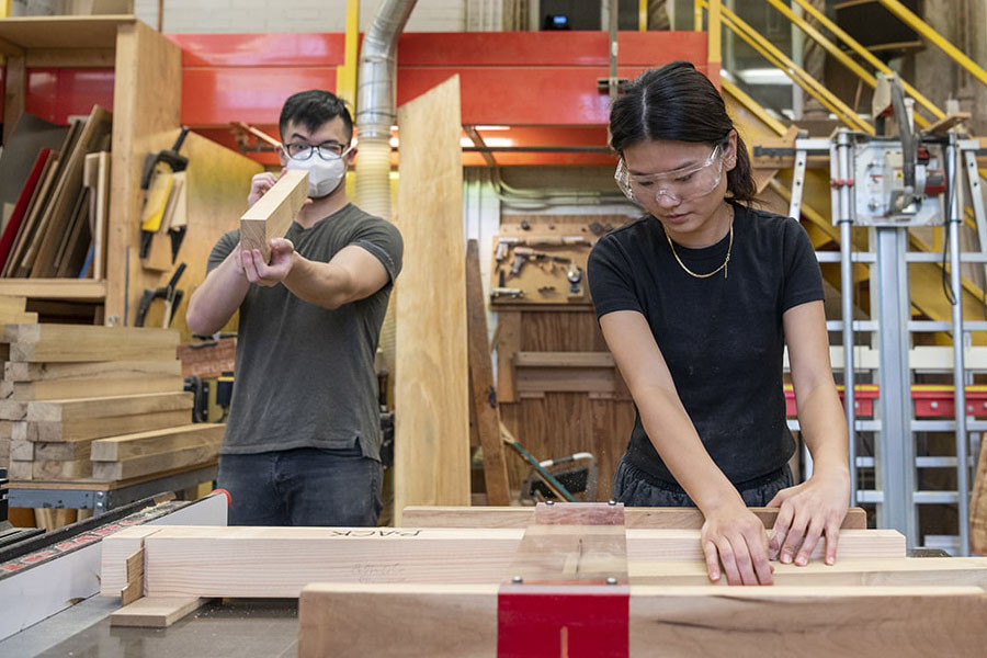 Student using a table saw.