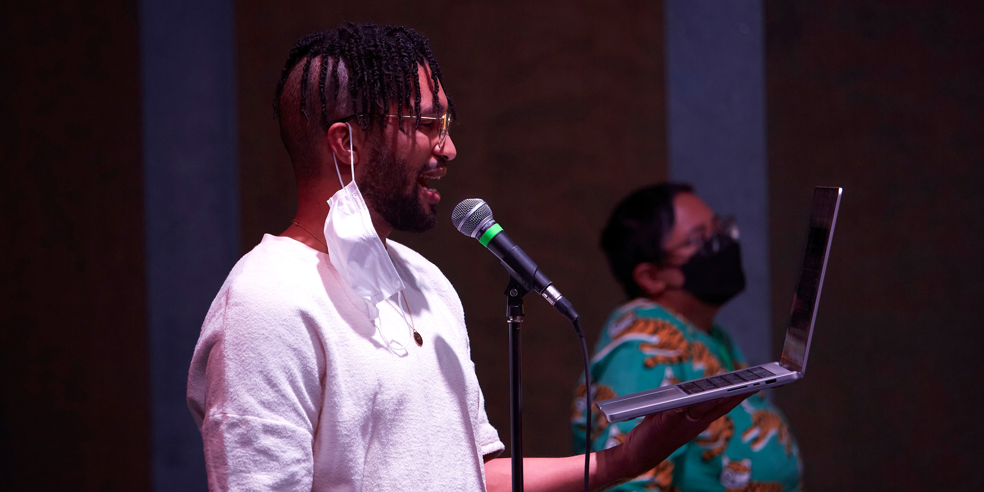 Person in front of a microphone.