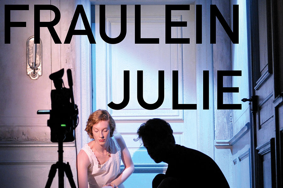 Photo taken from Fraulein Julie poster, woman lit in background with silhouettes of a camera and man in the foreground.