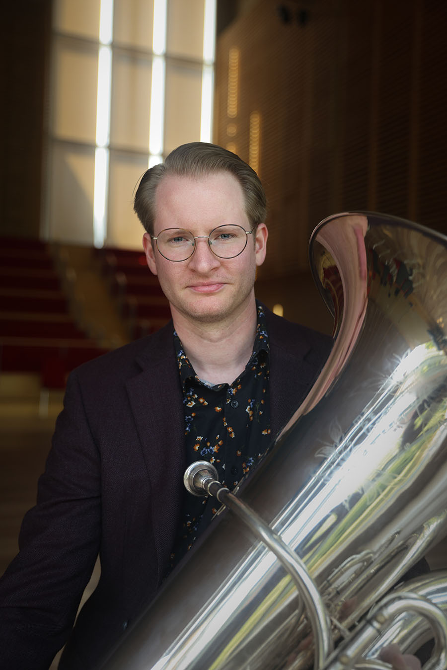 Christopher Pearlberg holding his tuba.