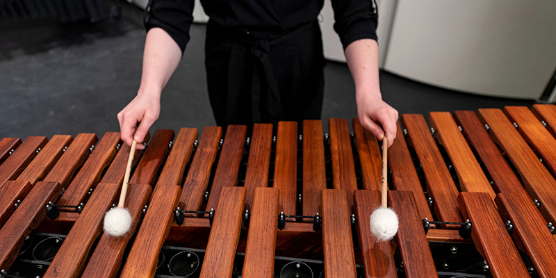 Student playing marimba.