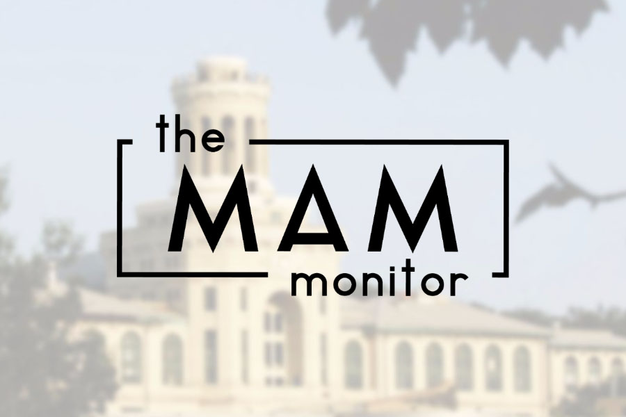 "The MAM Monitor" logo against a lightened, blurry photo of a building