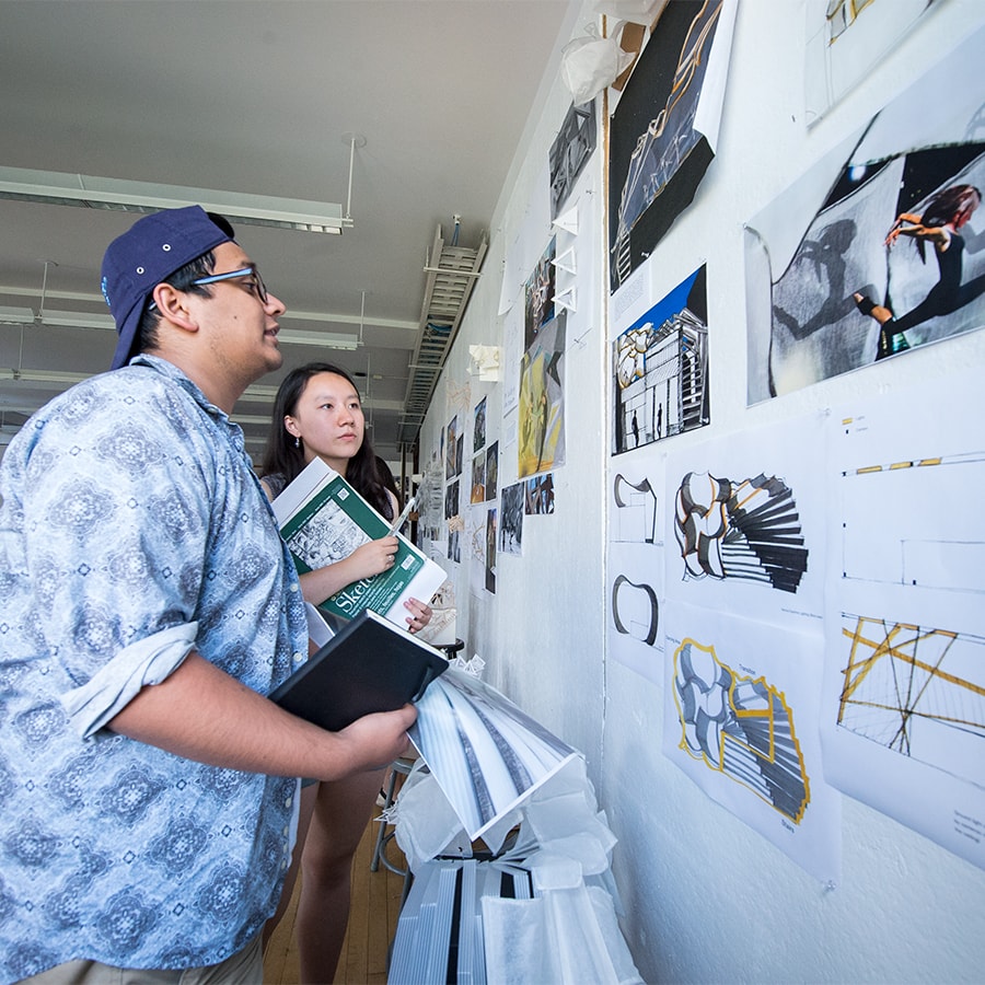 students looking at architecture board