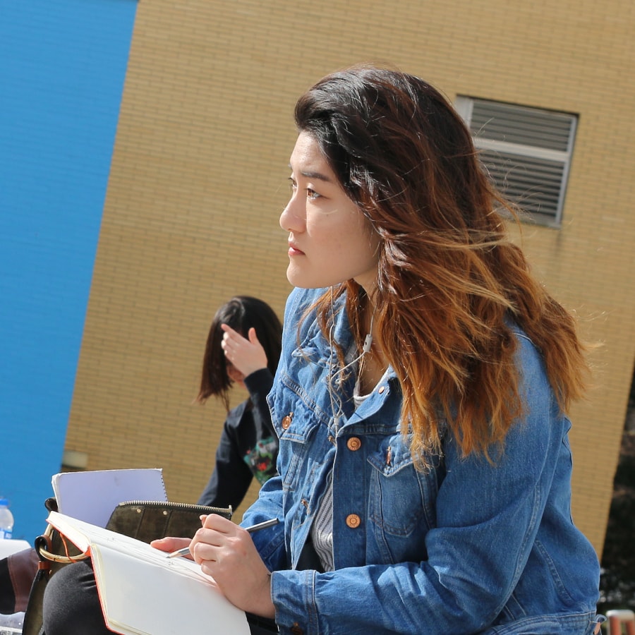 student sketching on Kraus Campo