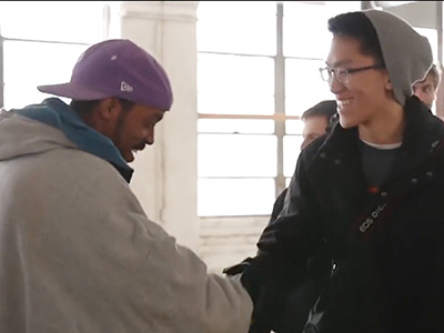 UDBS student shaking hands with a TIP apprentice.