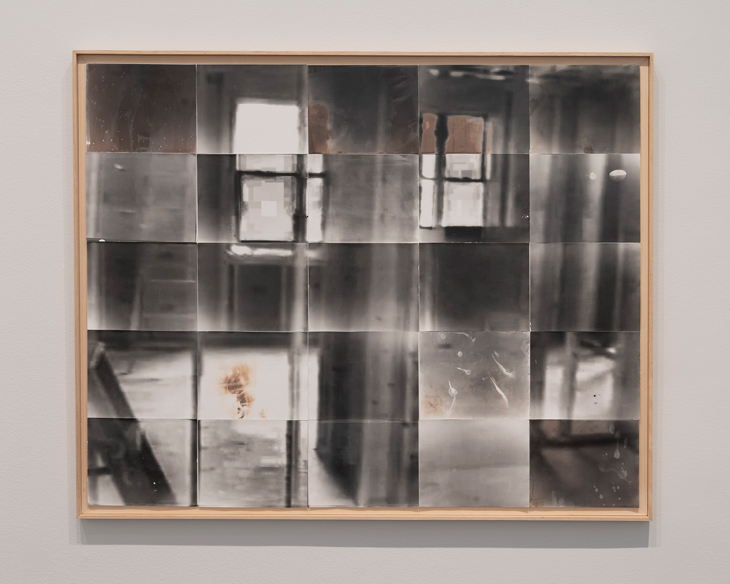 A grid of photographs that come together to form an image of a room.