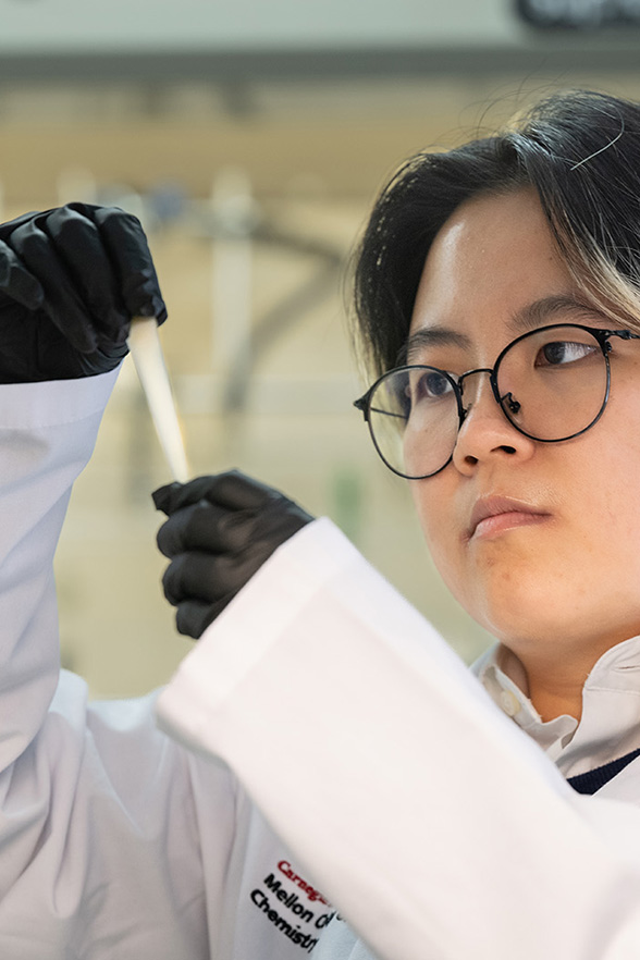 Student holding a pipette