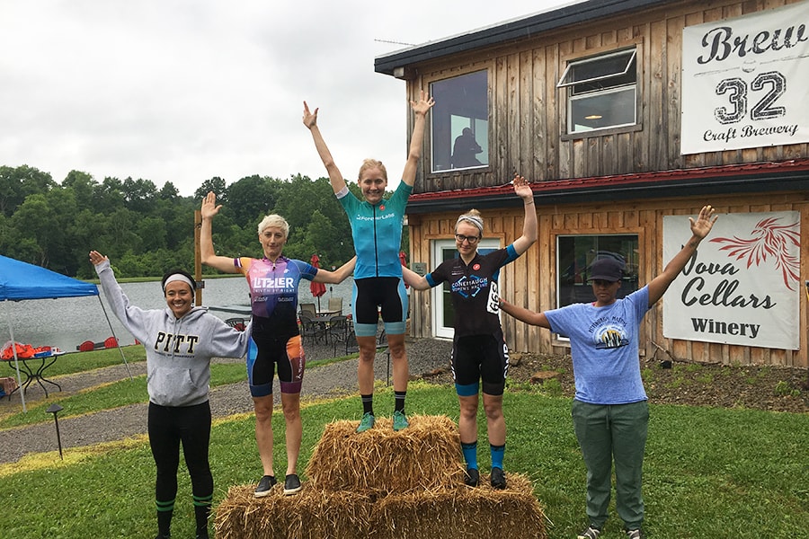 Stefanie Sydlik celebrates her victory atop the podium