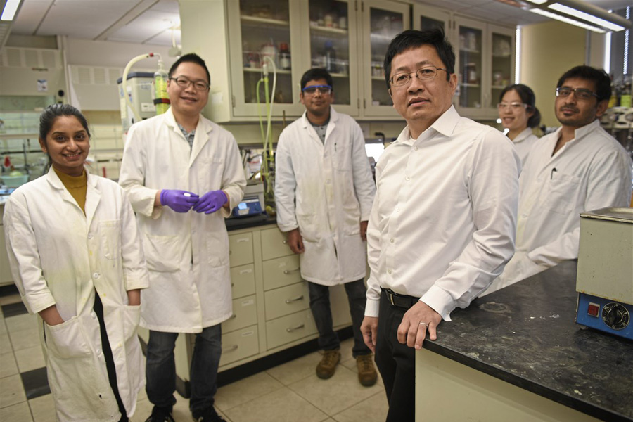 Danith Ly and his research group in the lab