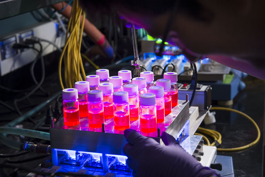 photo of glowing vials in laboratory