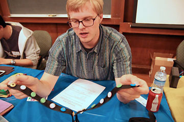 Taylor Canady demonstrating the DNA kit at the YCC Chemistry Carnival last fall.