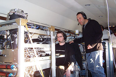 Ryan Sullivan (seated) and Paul DeMott of Colorado State University collect atmospheric data aboard a Department of Energy G-1 aircraft as part of the CalWater campaign.