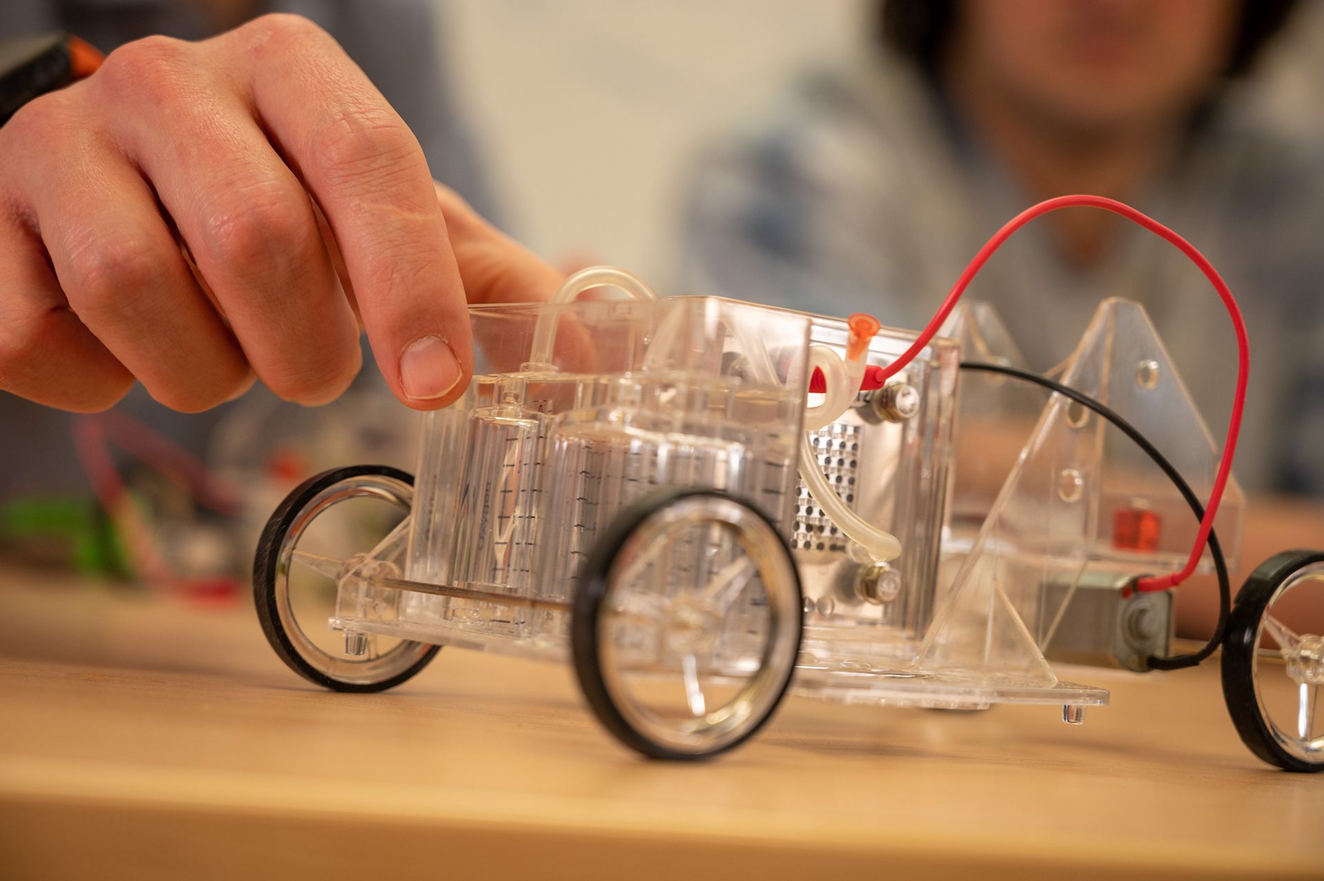 A close up image of a transparent car used to show how fuel cells work