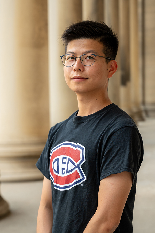 Image of man wearing glasses and a black tshirt.