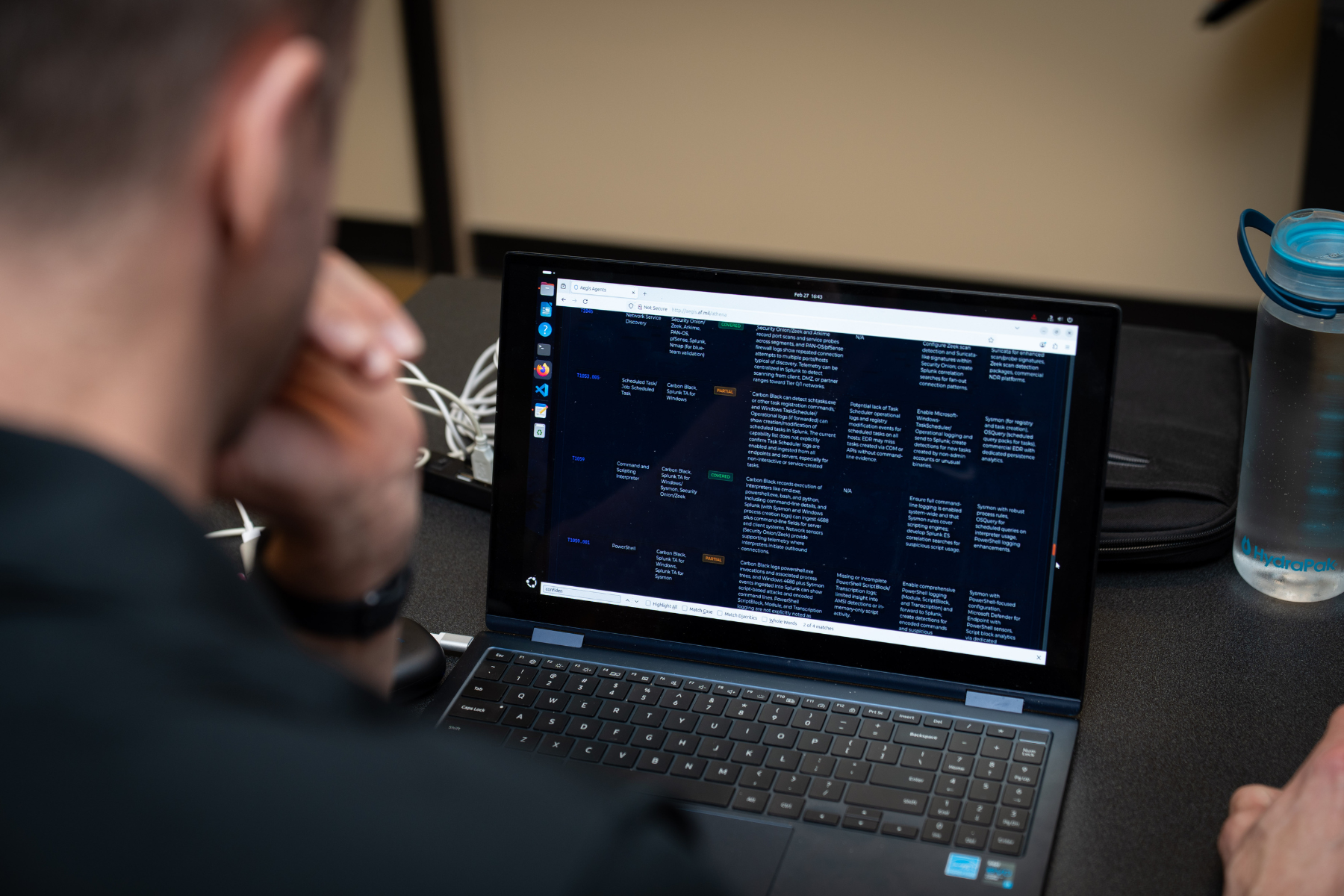 Agentic system, Aegis-4, displayed on a laptop.