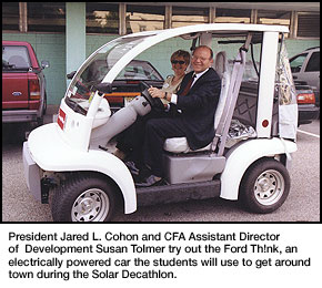 President Cohon and S. Tolmer try out the Ford Th!nk