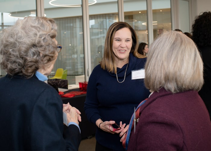 Honorary CMWA President Tris Jahanian chats with CMWA members.