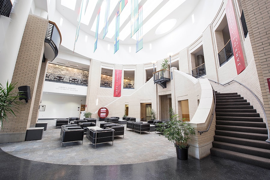 Photo of Kirr Commons with a view of the staircase and Black Chairs