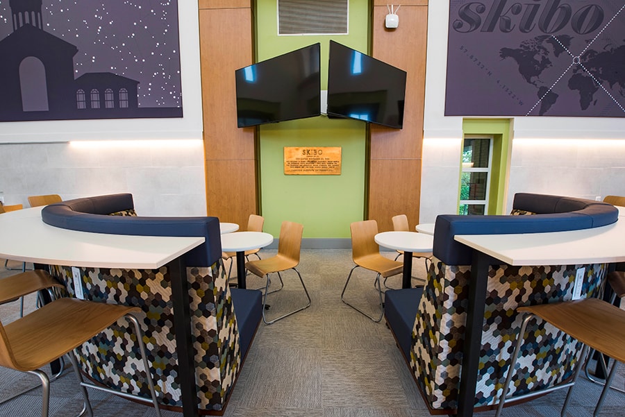 Photo of Skibo Café with view of booth seating and digital displays