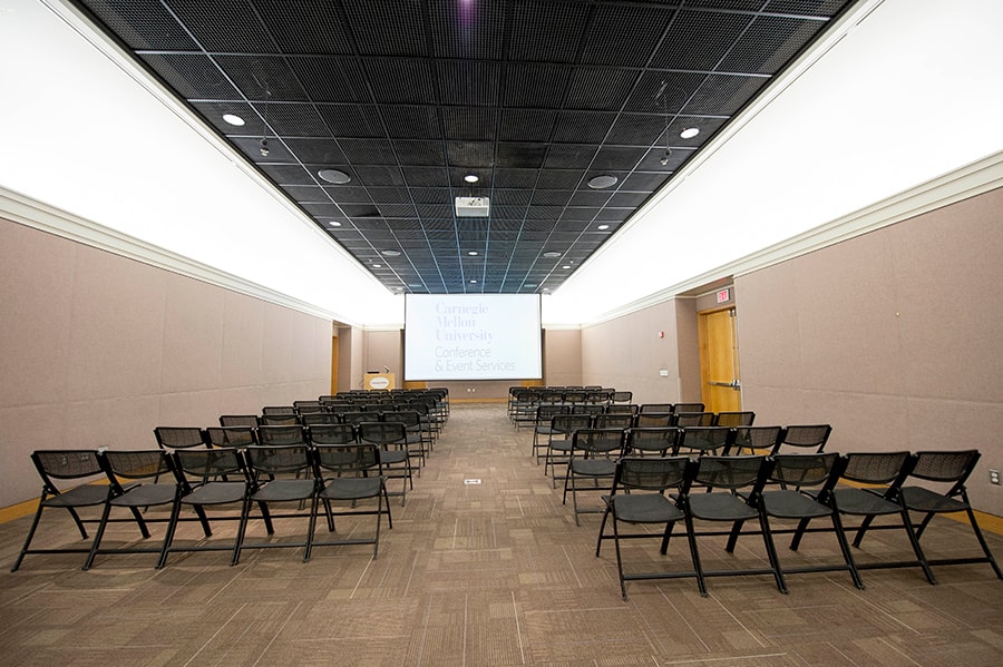 Photo of the Connan Room from the back wall facing the projector