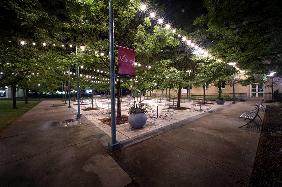 Photo of Legacy Plaza from the corner with view of benches and tables