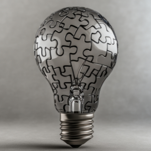 Photo of a lightbulb divided into jigsaw puzzle pieces, suggesting the idea of problem solving and ideas.