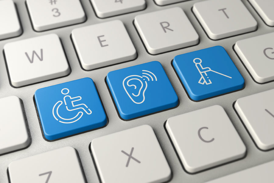 Image of a computer keyboard with icons representing hearing, visual, mobility disabilities.