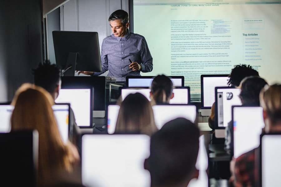 Professor teaching a classroom of students.