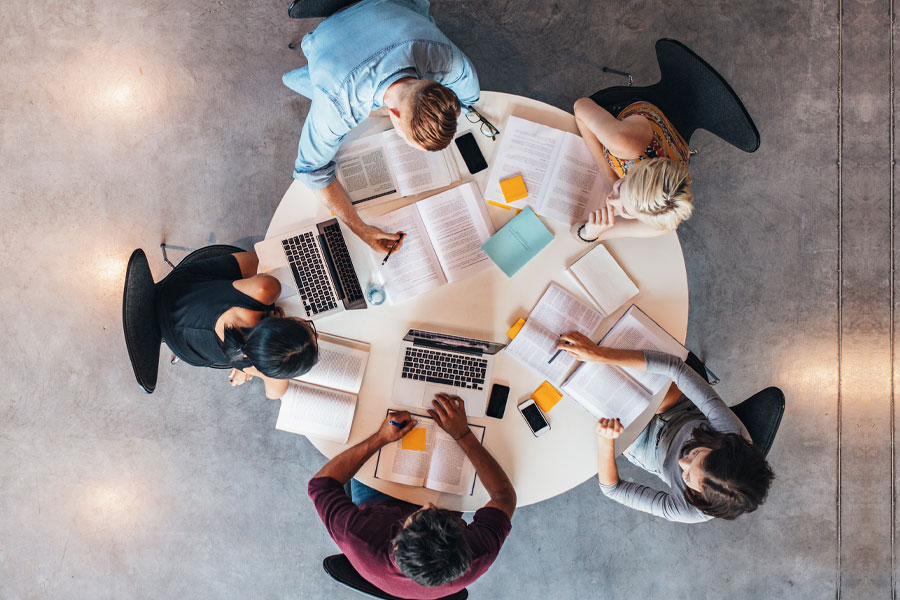 Students working together around a table.